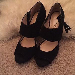 Black faux suede platform stiletto heels.